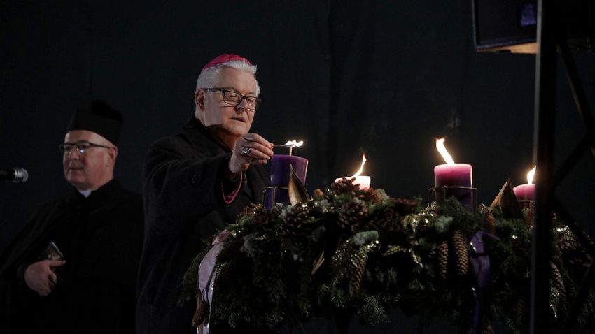 The flame of the fourth candle lit up