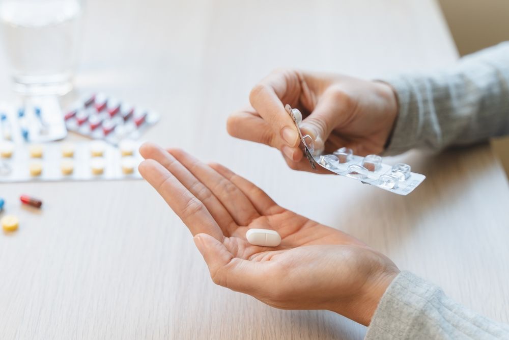 Healthcare,Harmony:,Close-up,Hands,Holding,Medication,And,Water,Glass,For
