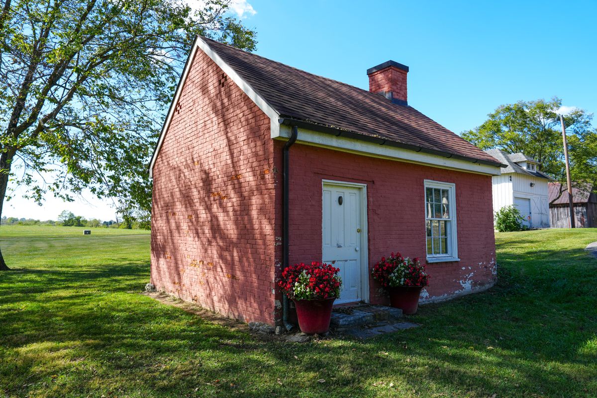Tiny,Brick,Home,With,Flower,Boxes