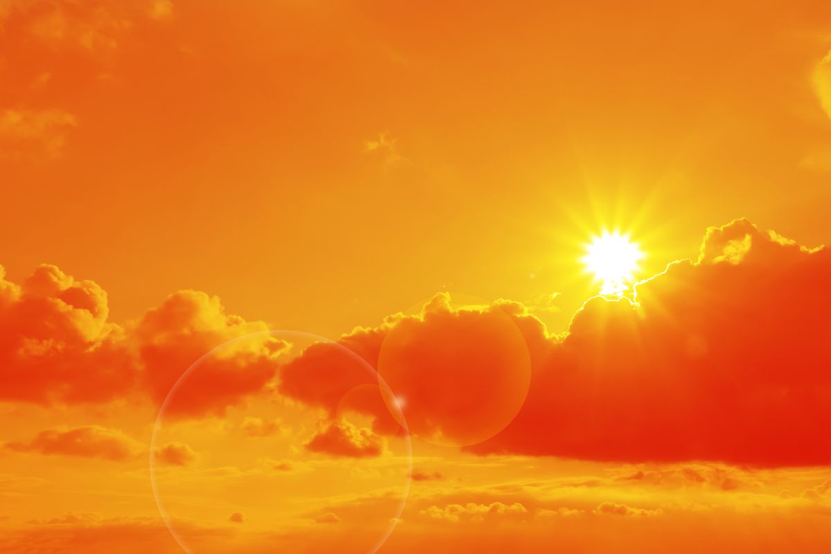Orange,Sky,With,Sun,And,Clouds,During,Hot,Summer,Weather